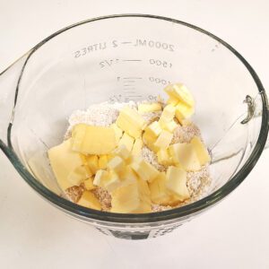 Butter chunks and dry ingredients in bowl for crust layer