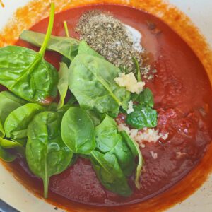 Spaghetti sauce ingredients in a pot