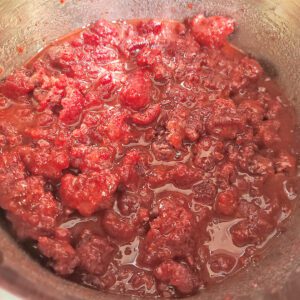Raspberries, sugar, lemon juice, and cornstarch mixed in saucepan