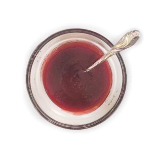 Raspberry lemon sauce cooled in glass bowl