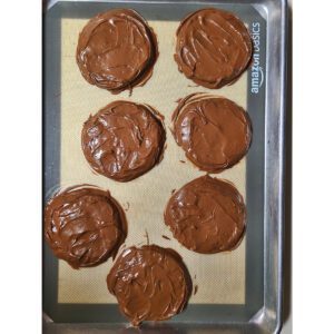 Cookies coated on baking sheet with silicone mat