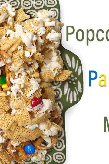 Popcorn Party Mix on green and white platter with word title