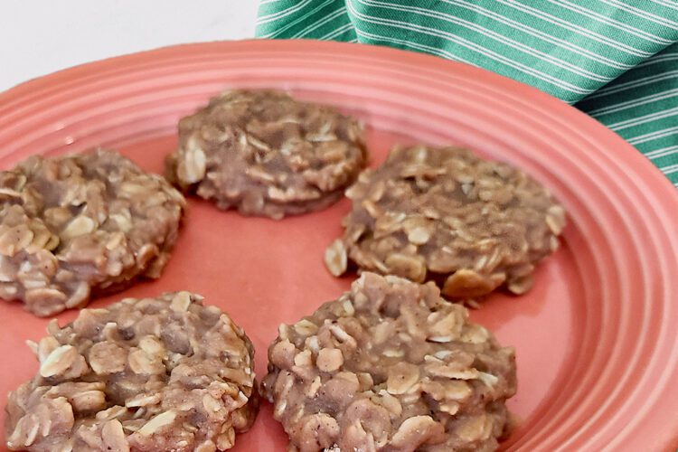 no bake cookies on a salmon colored plate with a teal striped cloth behind