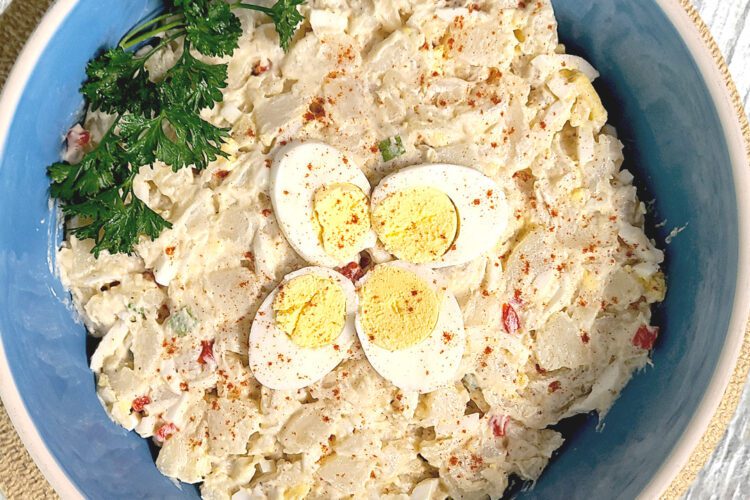 potato salad in a large blue bowl