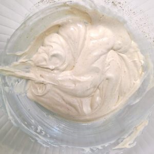 dressing mixture for potato salad in a clear glass bowl