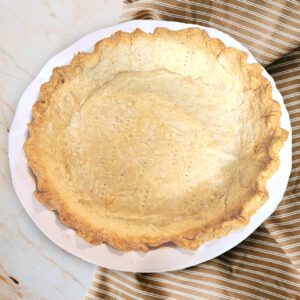 gluten free single pie crust baked in a ceramic pie pan