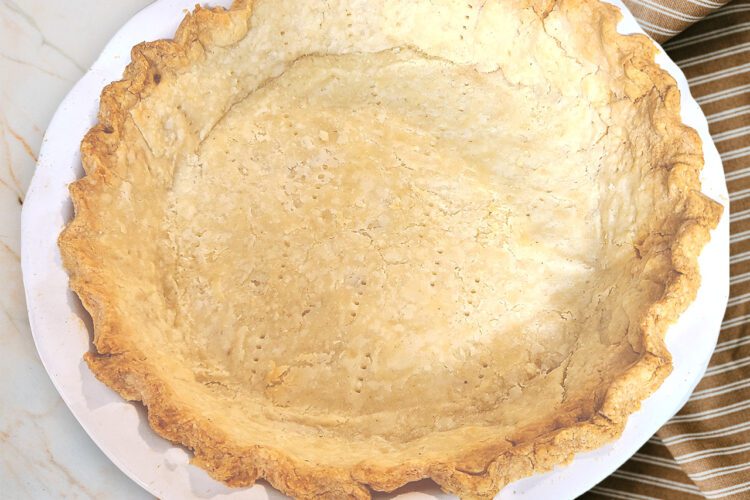 gluten free single pie crust baked in a ceramic pie pan
