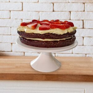 Gluten Free Strawberry Brownie Torte on a white cake stand