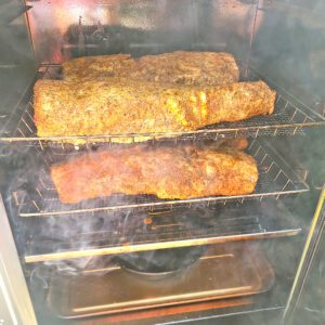 Pork loins cooking in Bradley Smoker