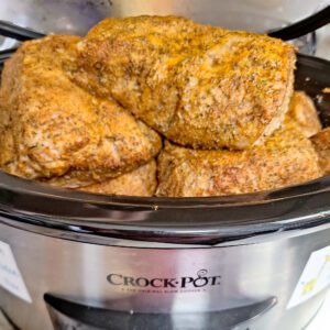 Smoked pork loin placed in crockpot to finish cooking