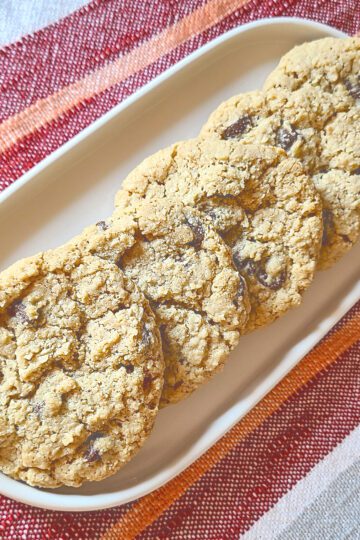 gluten free chocolate chip oatmeal cookies on a white oval plate