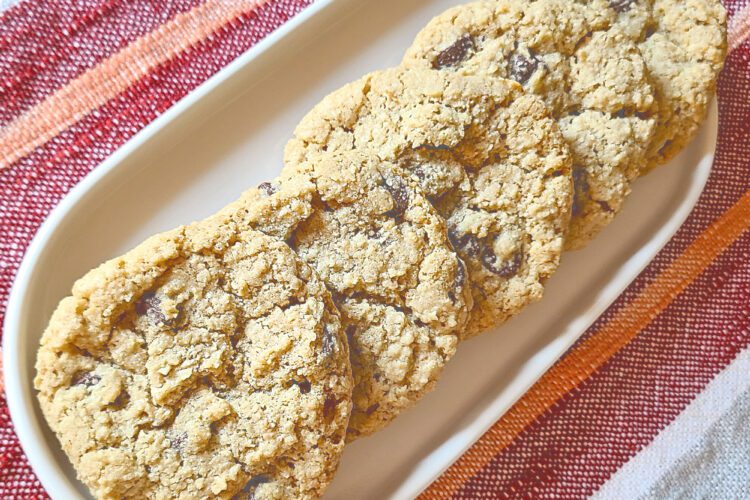 gluten free chocolate chip oatmeal cookies on a white oval plate