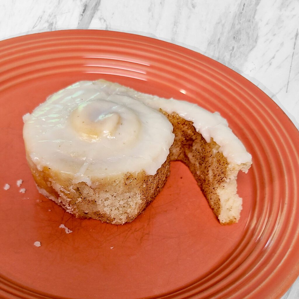 gluten free cinnamon roll plated on a serving plate