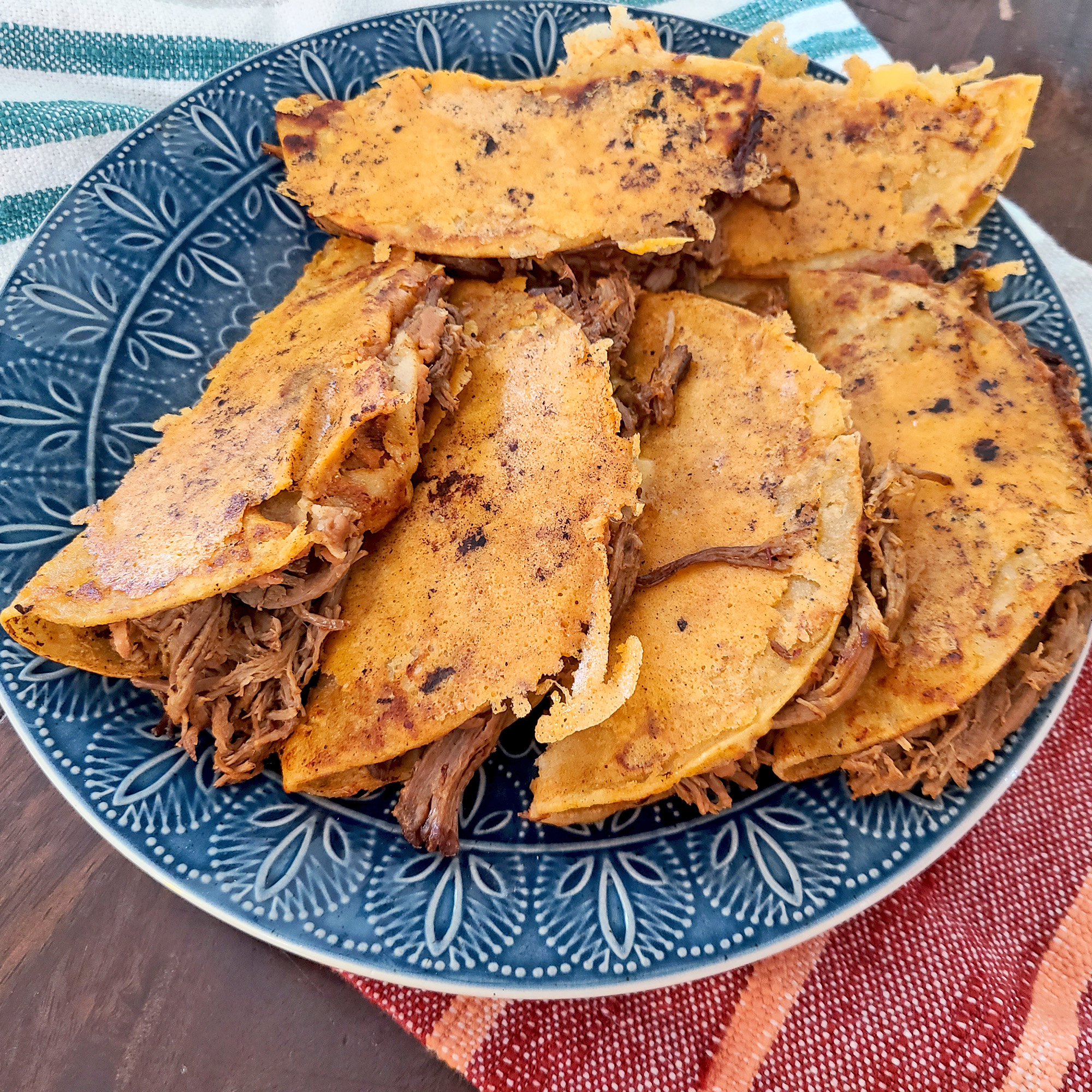 Birria Tacos on a blue plate